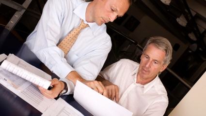 two businessmen discussing at the meeting