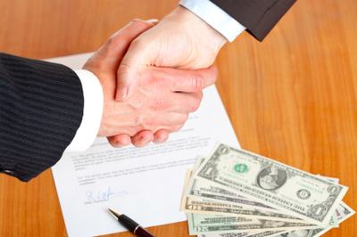 Business handshake after signed contract