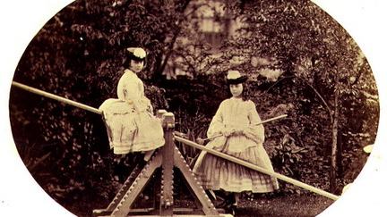 Liddell_Alice_and_Lorina_on_a_see-saw_Lewis_Carr