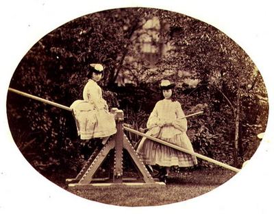 Liddell_Alice_and_Lorina_on_a_see-saw_Lewis_Carr