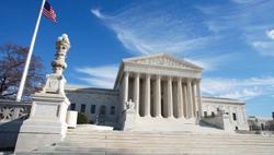 United States Supreme Court Building and American Flag