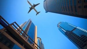 plane-over-buildings-00472122xAC2B5-300×199