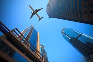 plane-over-buildings-00472122xAC2B5-300×199